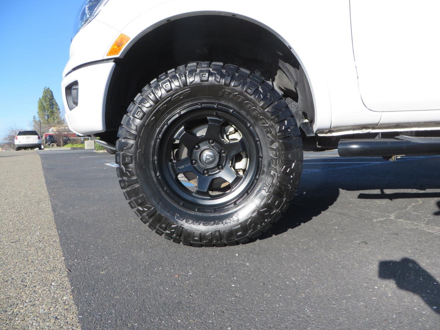 2019 White /Black Ford Ranger Lariat (1FTER4FHXKL) with an 2.3L engine, automatic transmission, located at 2630 Grass Valley Highway, Auburn, CA, 95603, (530) 508-5100, 38.937893, -121.095482 - Features a Fabtech suspension system, Fuel Offroad wheels, Nitto Ridge Grappler tires, Westin Running boards, and a Bakflip. - Photo#7